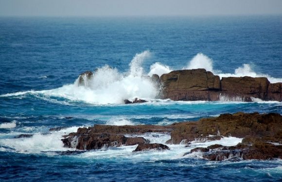 Ocean Waves Crashing onto Rocks