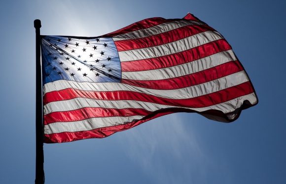 US Flag with sun shining through