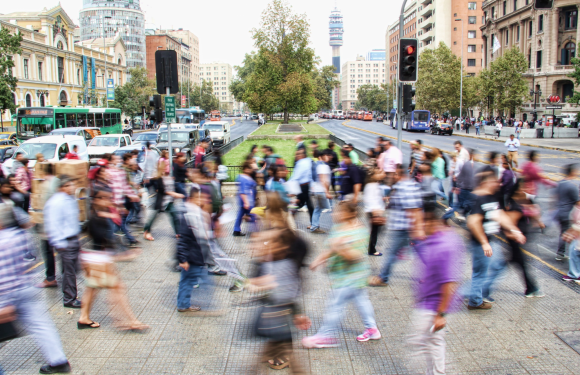 blur of busy people in the crosswalk