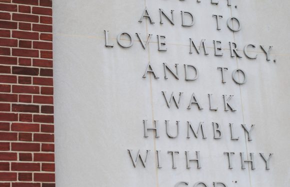 Micah 6:8b on a cement wall. "and to love mercy, and to walk humbly with thy God."