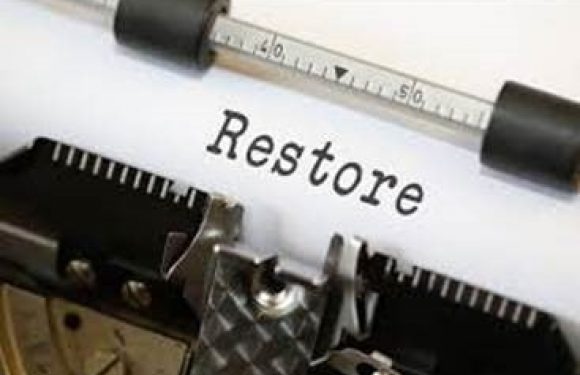 Typewritten word Restore on paper in typewriter