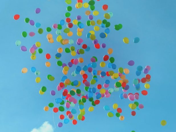 Brightly colored balloons in the sky