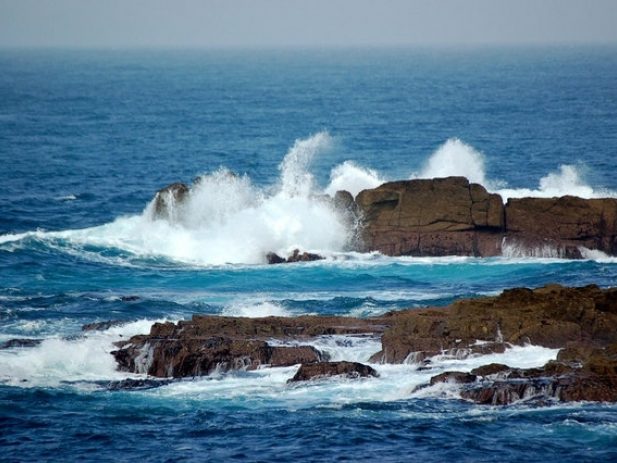 Ocean Waves Crashing onto Rocks