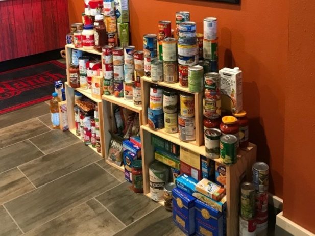 Stack of canned and boxed food donations.