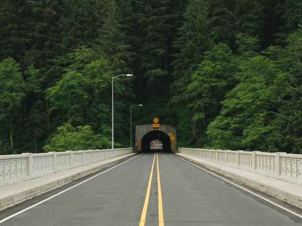 Image of a Road going through a tunnel, representing moving forward