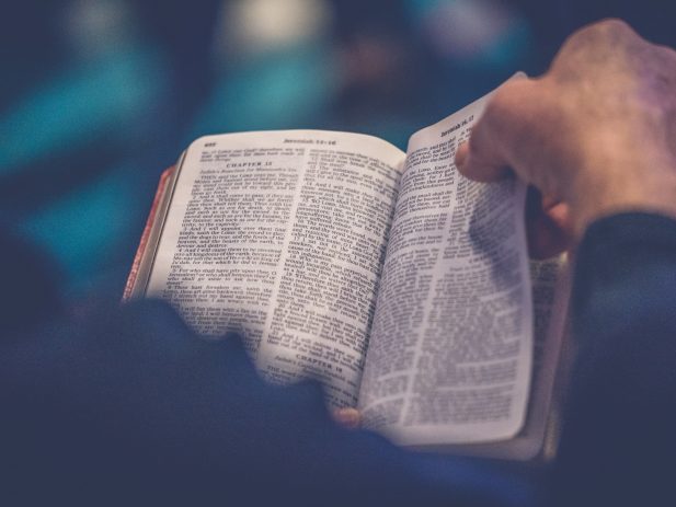 Picture of a man holding a bible