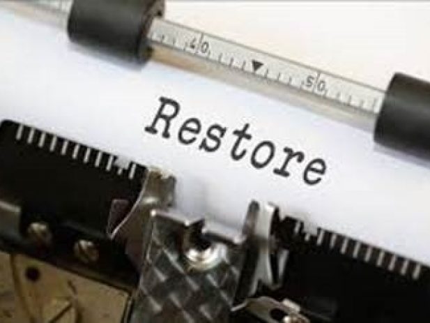 Typewritten word Restore on paper in typewriter