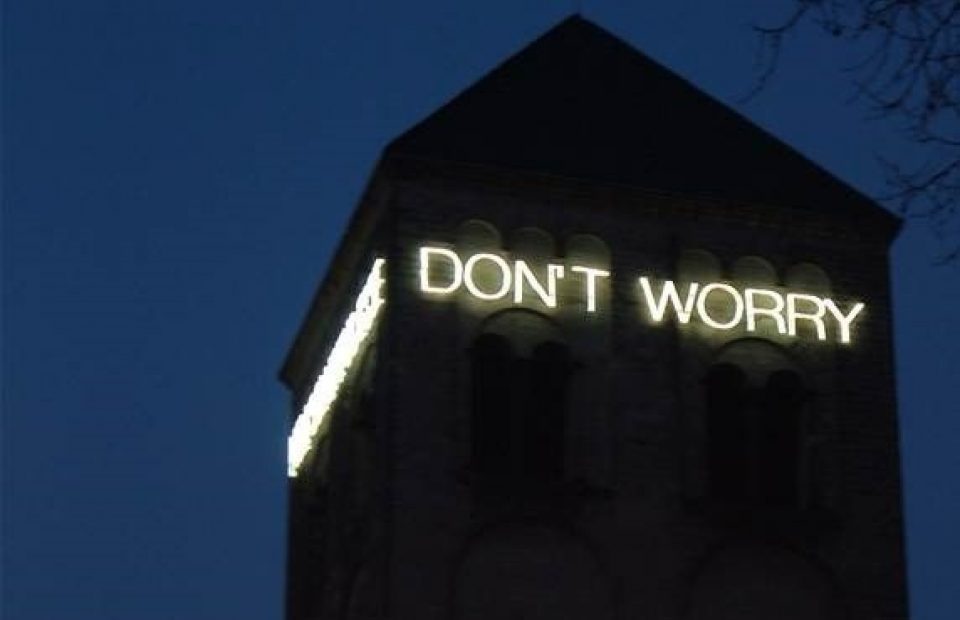 Don't Worry Neon Sign on Building