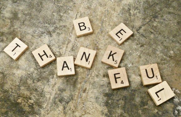 Scrabble Letters spelling out "Be Thankful"